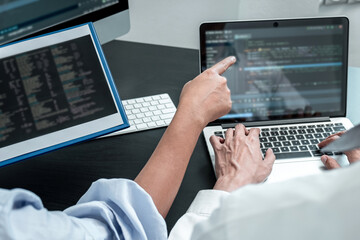 Wall Mural - team of programmer working in software javascript computer in it office, writing codes and data code