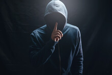The Hacker In The Hood Makes A Silence Gesture