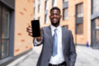 © Prostock-studio - African american businessman showing smartphone with empty screen, recommending new mobile application or website