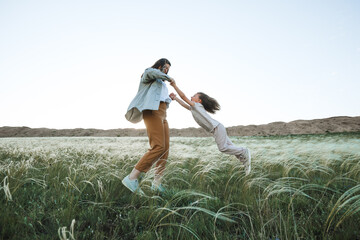 Wall Mural - Mom and son are active in nature.