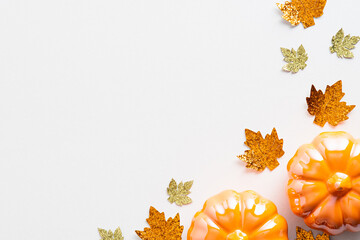 Wall Mural - Autumn background with pumpkins and orange leaves on white. Flat lay, top view, copy space. Autumn, fall concept.