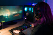 Rear view of a female gamer with purple hair
