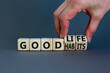 © Dzmitry - Good habits and life symbol. Businessman turns wooden cubes and changes words 'good habits' to 'good life'. Beautiful grey background, copy space. Business and good habits and life concept.