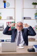 © Elnur - Old male employee feeling bad at workplace