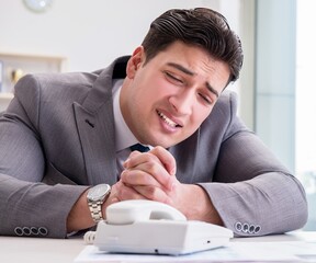 Businessman expecting important call on phone