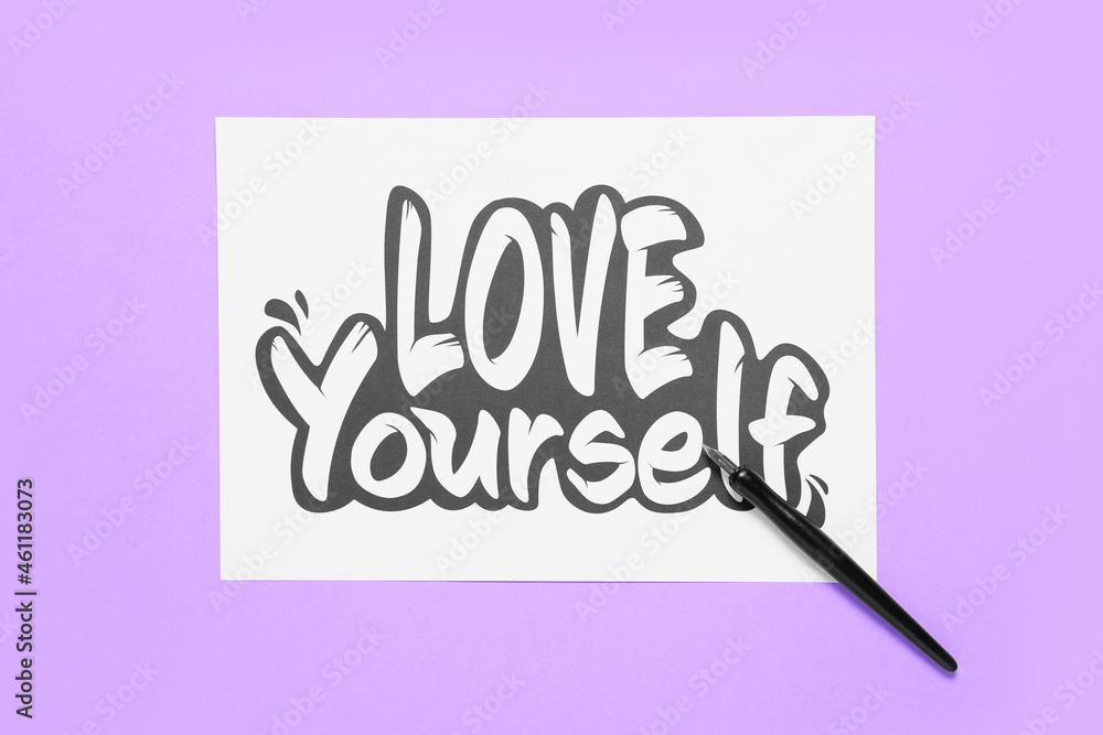 Paper with text LOVE YOURSELF and nib pen on lilac background