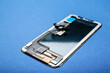 © Pixel-Shot - Mobile phone display module on blue background