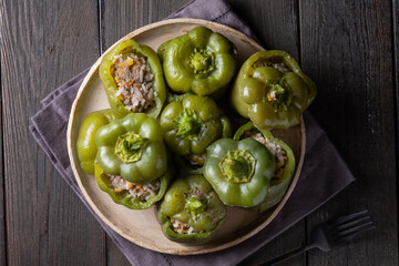 Wall Mural - Green bell peppers stuffed with meat, rice and vegetables. Tasty food. 