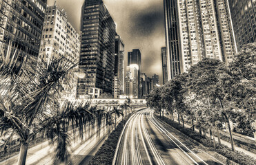 Poster - Hong Kong buildings and traffic. City skyline at night. Business concept