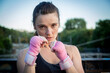 © luisrojasstock - portrait female young caucasian boxer posing looking at camera