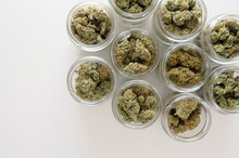 Cannabis Drying And Curing. Marijuana Buds In Glass Jars. Eco Container. Hemp Growing Concept.