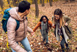 © Zoran Zeremski - Three female friends having fun and enjoying hiking in forest.