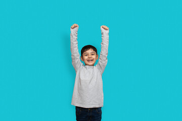 Surprise, excitement and fascination concept. Pakistani Asian little boy shocked with astonishing unexpected news, having amazed look