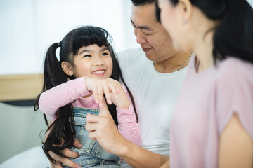 father and mother with children in concept of family relationship together, happy daughter woman with love and happy life at home