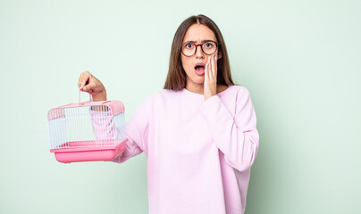 Poster - young pretty woman feeling shocked and scared. pet cage concept