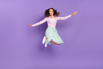 Canvas Print - Full size photo of cool young brunette lady jump wear shirt skirt footwear isolated on violet background