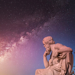 Socrates, the ancient Greek philosopher statue under starry night sky, Athens Greece