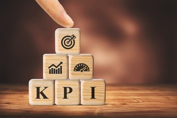 Poster - KPI, Key Performance Indicator. Wooden cube with icon; business goals, performance results