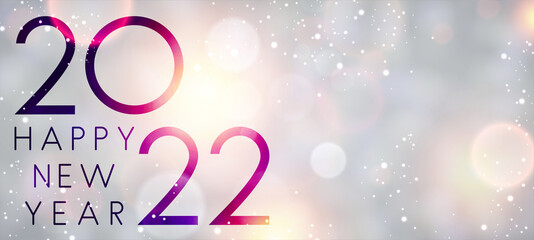 Fogged glass 2022 sign on colorful bokeh background.