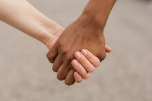 Multiethnic Best Friends Holding Hands Tenderly