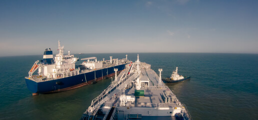 Two large gas carriers make STS operation at sea.