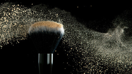 Wall Mural - Soft cosmetics brush releasing a cloud of beige face powder.