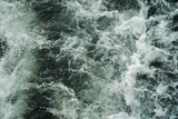 Fototapeta Przestrzenne - Dark water swirling waves and foam texture background