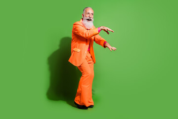 Poster - Full length body size view of attractive elegant cheerful grey-haired man dancing fooling isolated over bright green color background