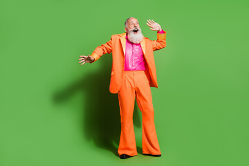 Sticker - Full length body size view of attractive amazed imposing cheerful man having fun isolated over bright green color background