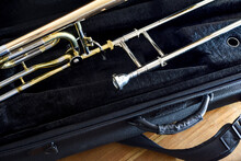 Trombone Detail With Transposer Mounted And Supported On Suitcase Top