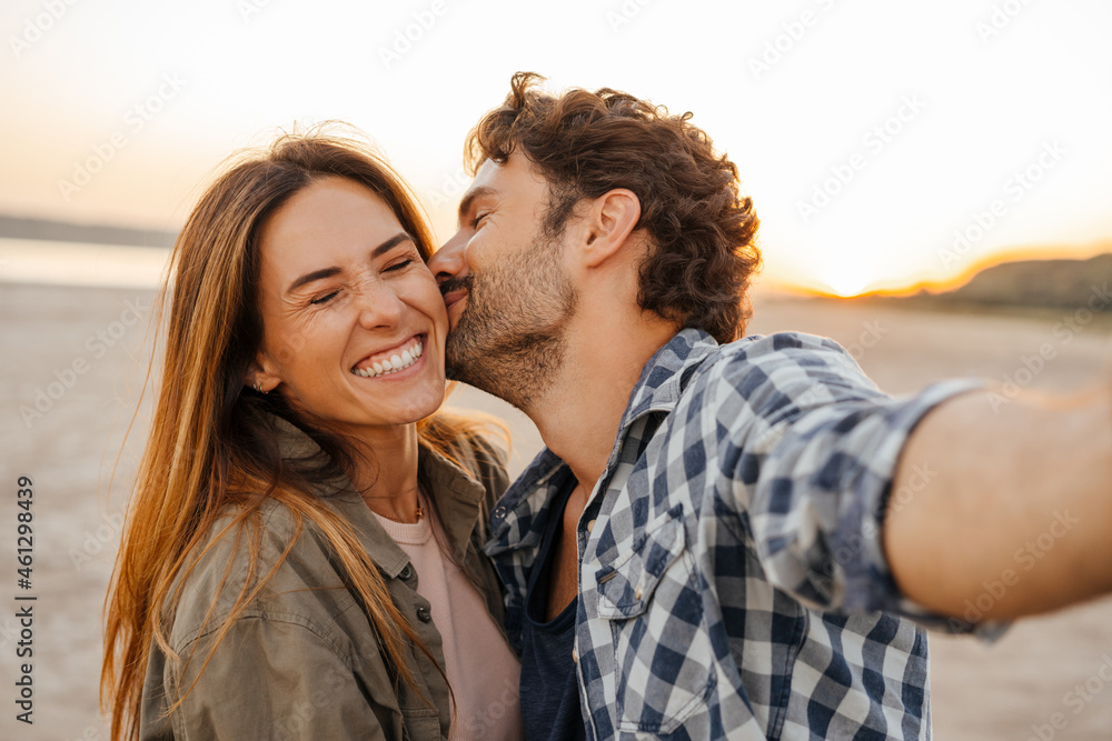 Young Couple Kissing And Hugging