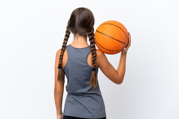 Sticker - Little caucasian girl isolated on white background playing basketball in back position