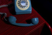 Blue Retro Phone On Red Table
