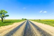 © BillionPhotos.com - Empty countryside road near the green field and trees