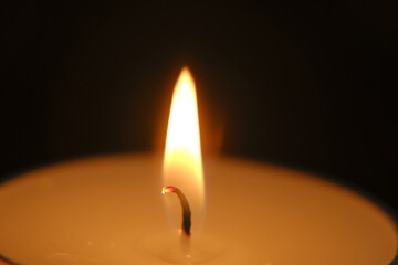 Candle on black background..Candle flame.Burning candles in the dark. candle flame.