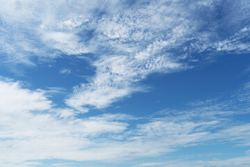 Wall Mural - Beautiful clouds during spring time in a Sunny day. Blue sky and white fluffy clouds