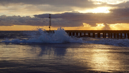 Wall Mural - pier in the sunset with reflections at cinquale of montignoso near massa in north of tuscany