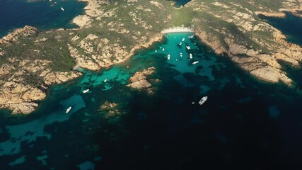 Sticker - View from above, stunning aerial view of Mortorio island with a beautiful white sand beach and some boats and yachts floating on a turquoise, crystal clear water. Sardinia, Italy.