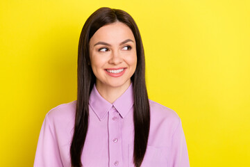 Wall Mural - Portrait of attractive cheerful curious girl thinking copy space ad isolated over bright yellow color background