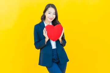 Poster - Portrait beautiful young asian woman smile with heart pillow shape