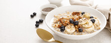 Oatmeal Bowl. Oat Porridge With Banana, Blueberry, Walnut, Chia Seeds And Almond Milk For Healthy Breakfast Or Lunch. Healthy Food, Diet. Banner.