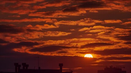 Aufkleber - Sunset sun clouds sky over dark city skyline, timelapse