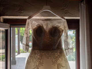 Sticker - Beautiful bridal dress hanging before the wedding ceremony