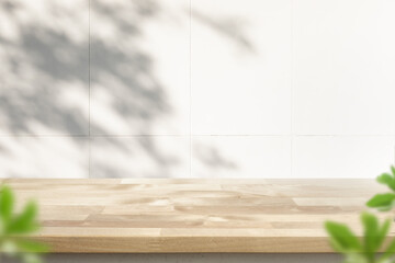 Wall Mural - Wood table top on blur home wall background.