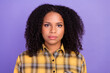© deagreez - Photo of serious young dark skin woman wear plaid shirt casual calm face isolated on purple color background