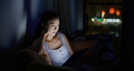 Poster - Woman work on tablet at home in the evening