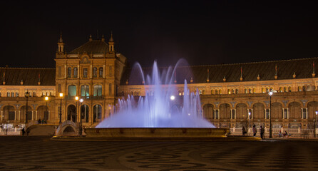 Wall Mural - the fountain shines in the night of Seville