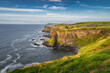 Spectacular coastline, Dunluce Castle located on edge of the cliff, Bushmills, Northern Ireland. Filming location of popular TV show Game of Thrones