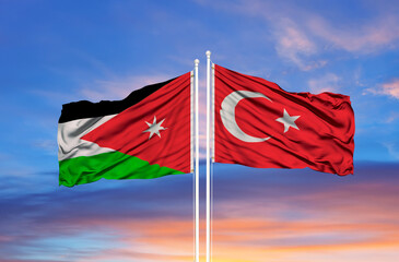 Wall Mural - Turkey and Jordan two flags on flagpoles and blue cloudy sky