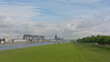 iver Rhine, with Kranhaus and other apartment buildings on one embankment and poller wiesen green city park with hiking trail on the other side, with gothic cathedral in the distance in Cologne, Germa